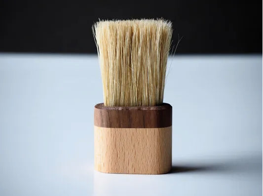 Hog-bristle brush with walnut handle included with the shaver