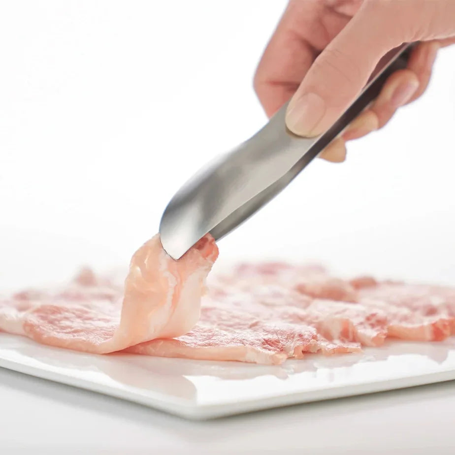 Picking up thin slices of ham with Hasam S tongs