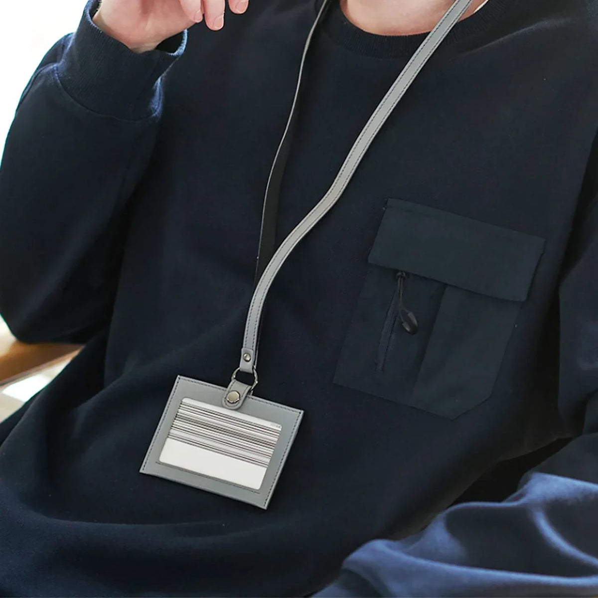 Wearing an hmny leather ID card holder on a lanyard
