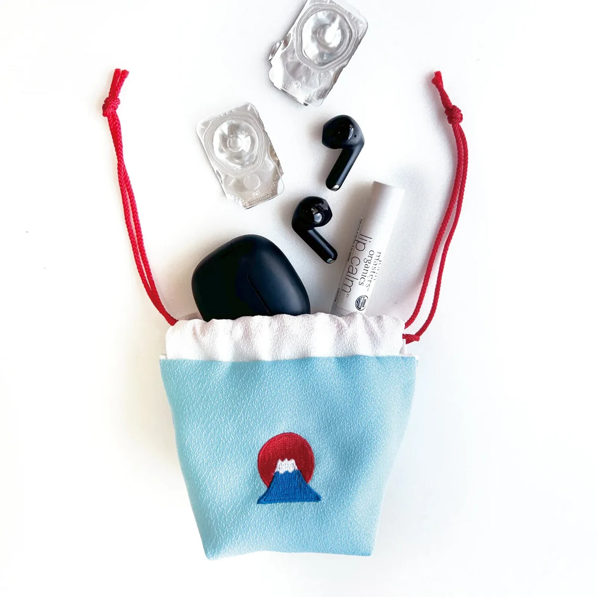 Earphones and small items in the drawstring pouch