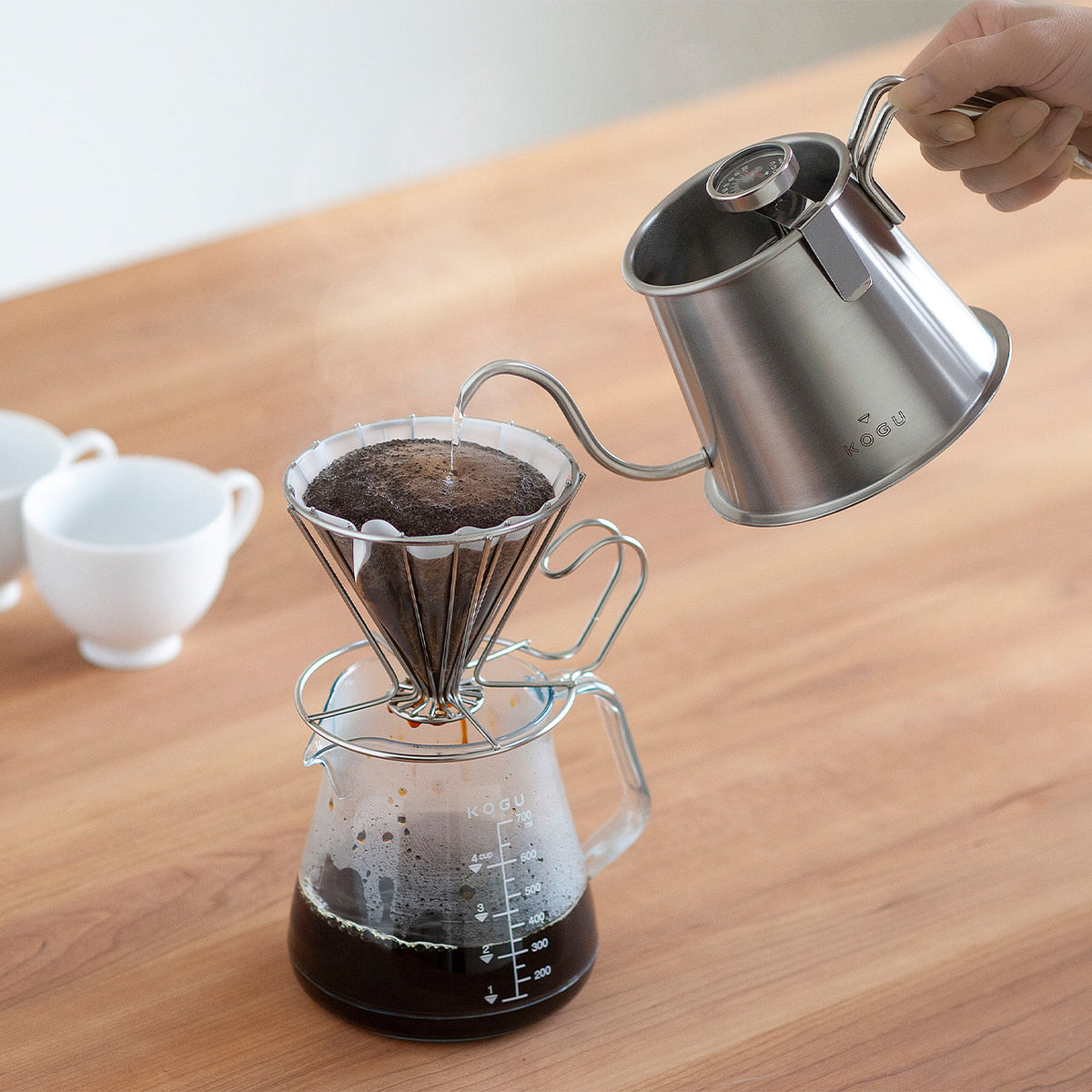 Brewing coffee into a glass server with the Two Drip Pot Pro