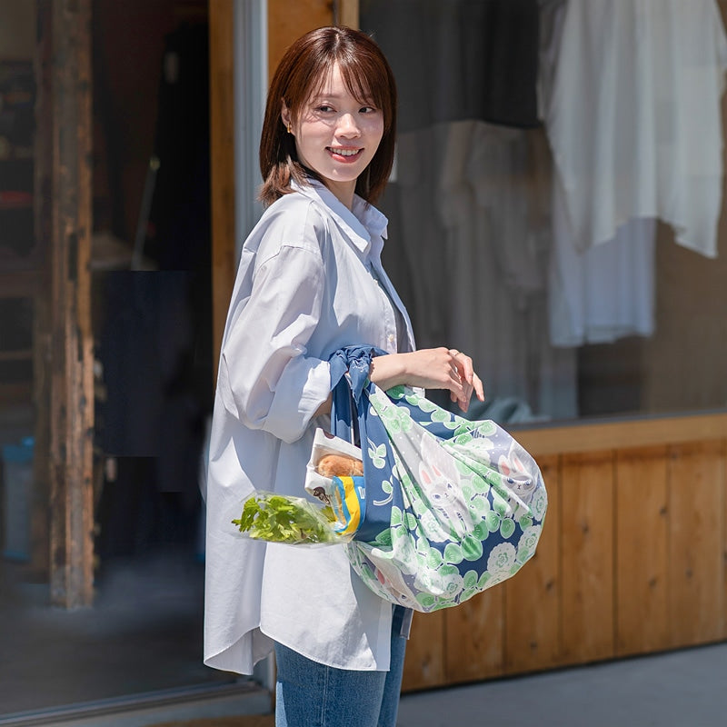 NAGARE furoshiki in Rabbits & Clover pattern tied as a shoulder bag #Pattern_Rabbits & Clover