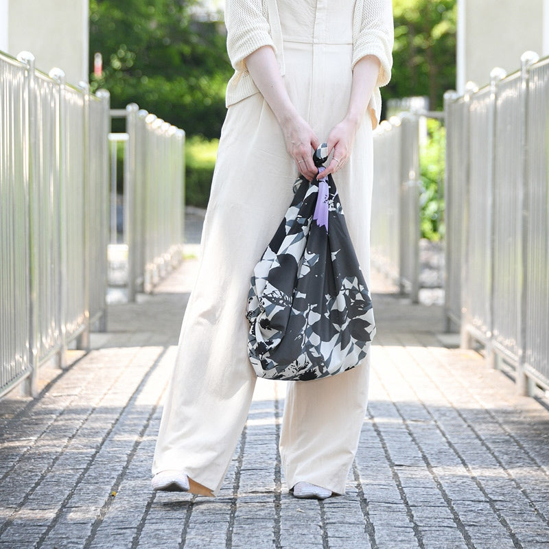 NAGARE furoshiki in Impression pattern tied as a shoulder bag #Pattern_Impression