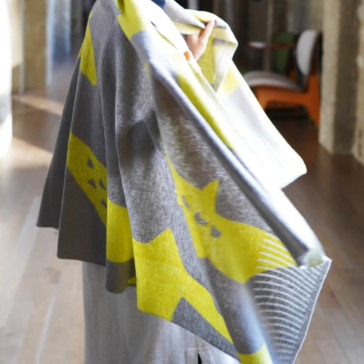 Gray tori stole draped over the shoulders