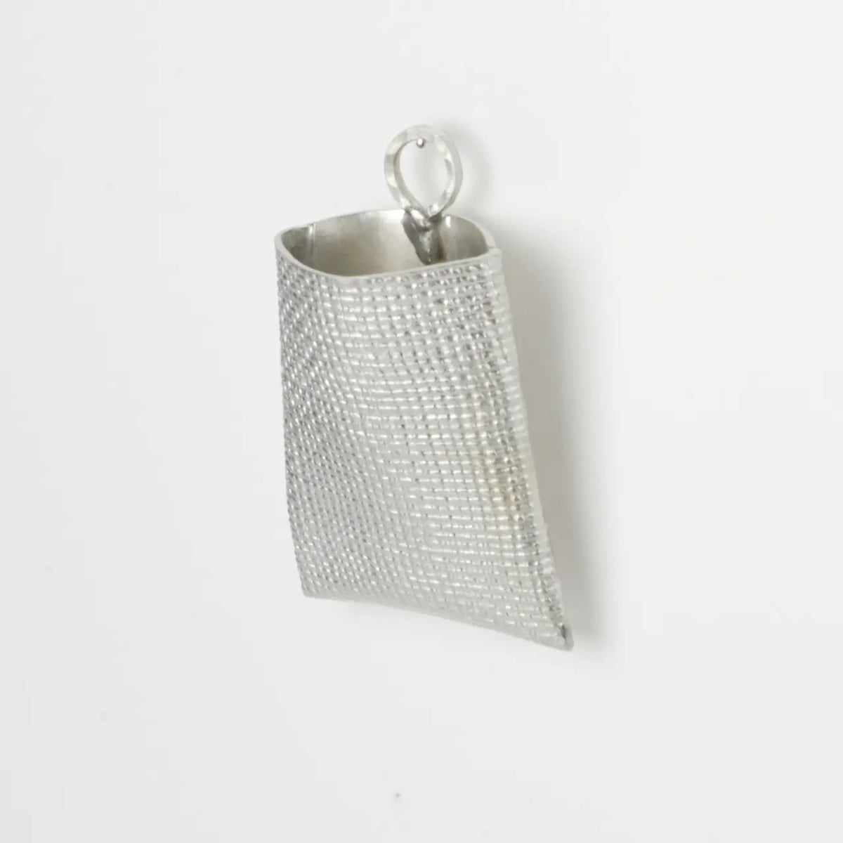 Suzuhana tin wall vase with its hanging ring, close-up