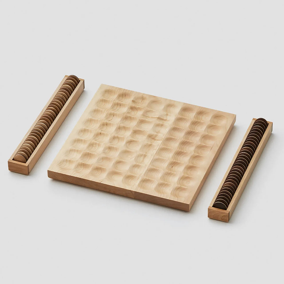 Wooden reversi board with walnut and birch pieces in their cases