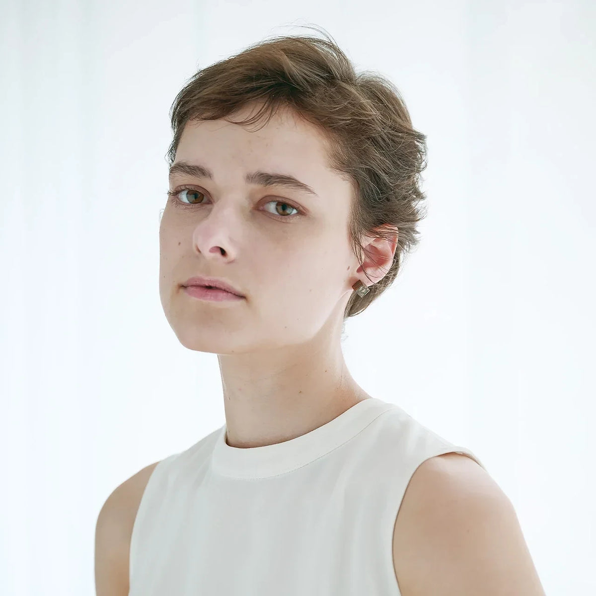 soil diatomaceous earth fragrance cube earrings worn