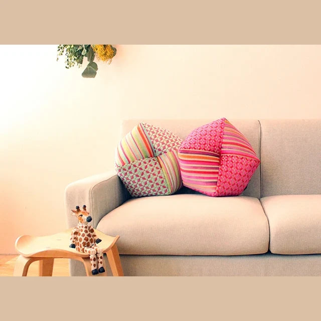 Ojami cushions Casamance on a sofa