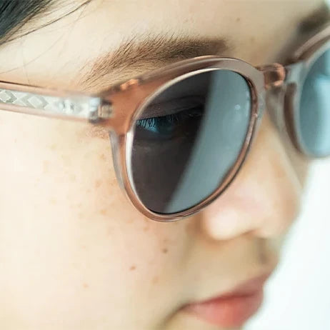 A woman wearing tesio HARE sunglasses