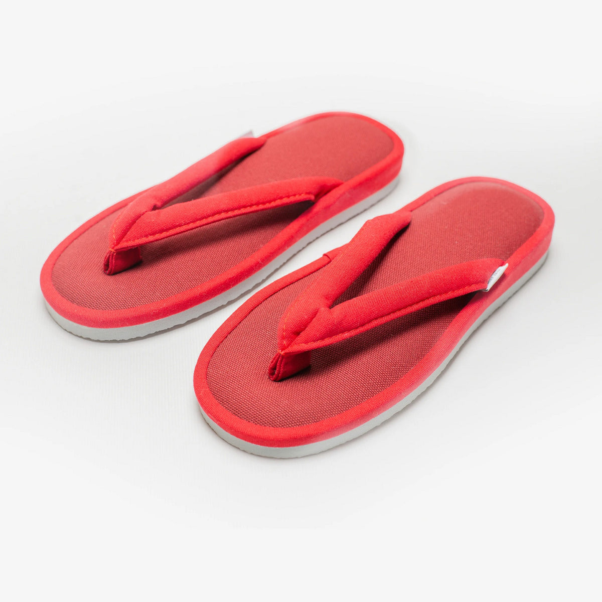 Cardinal red canvas zori room sandals, angled view #Color_Cardinal Red