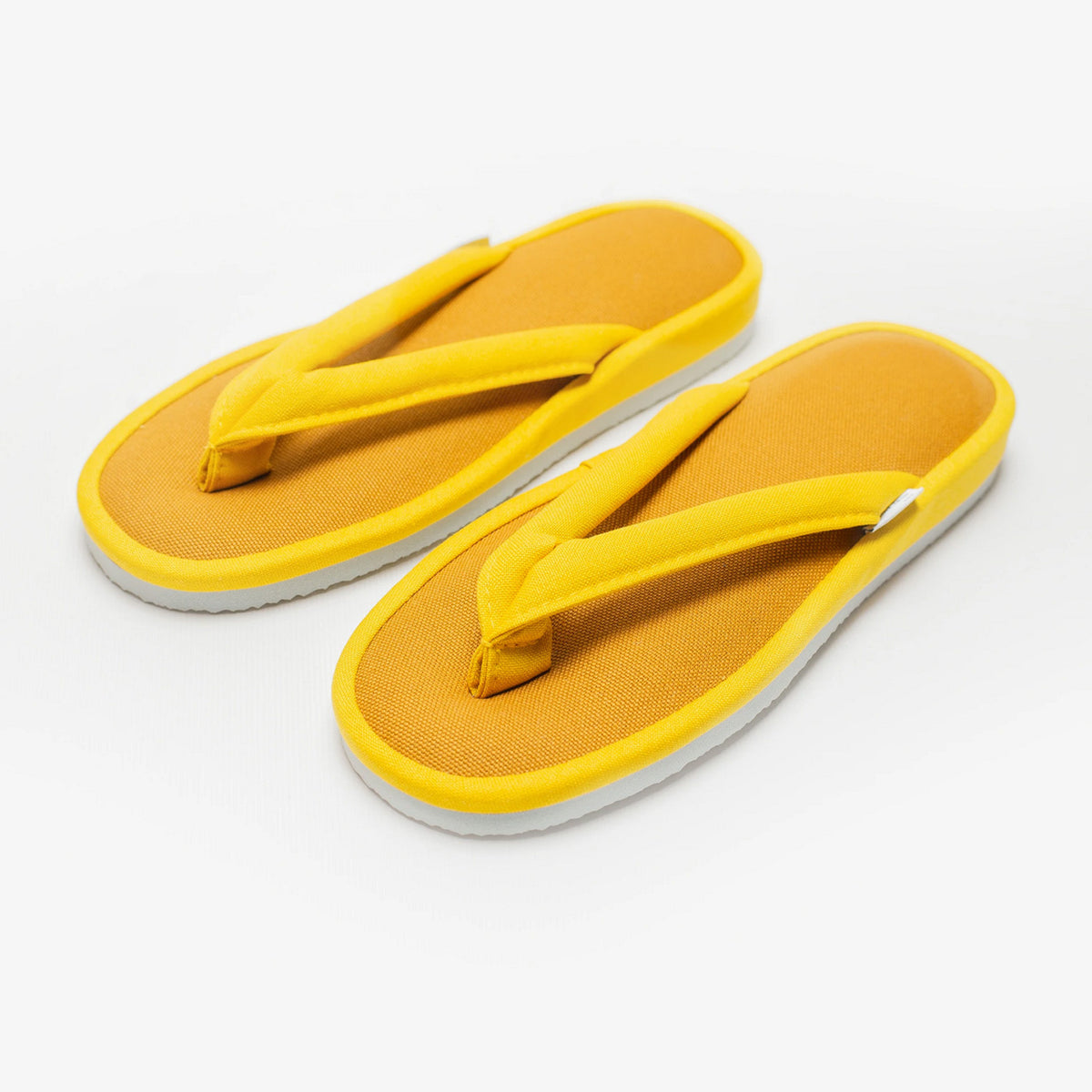 Mustard yellow canvas zori room sandals, angled view #Color_Mustard Yellow