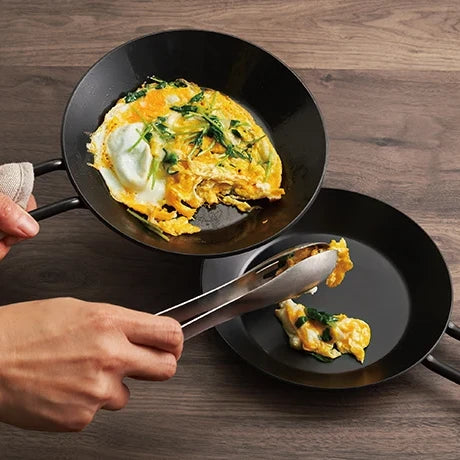 Serving an omelette from the Tetsu Pan