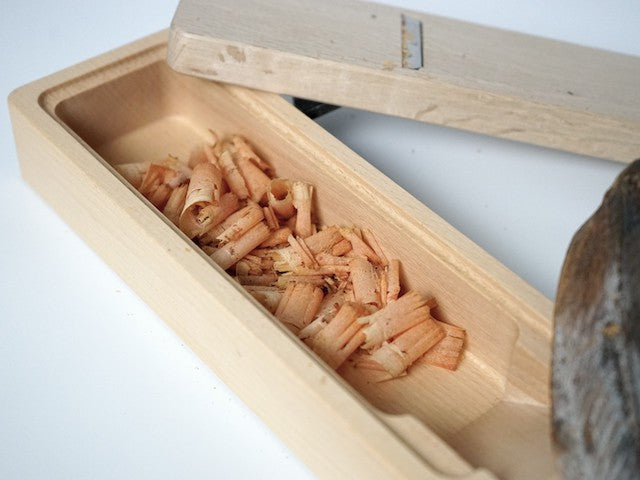 Freshly shaved bonito flakes collected in the beech box