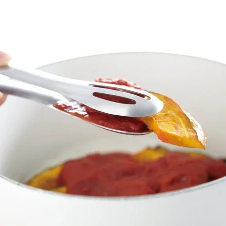 Hasam tongs serving food from a pot