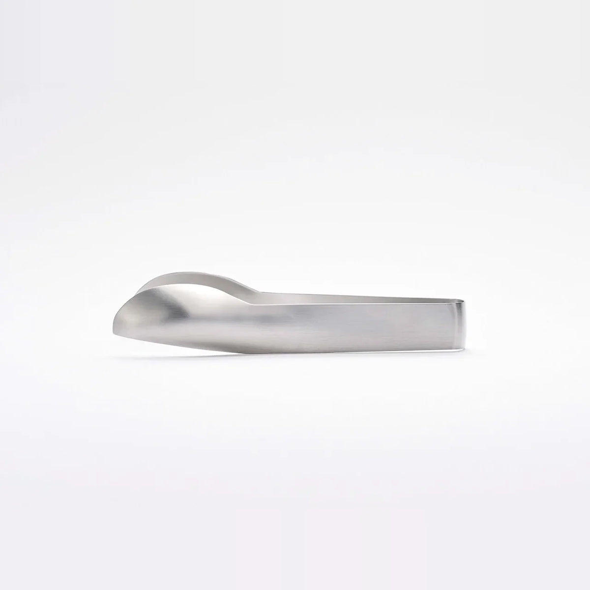 Hasam S tongs resting with the tips raised off the table