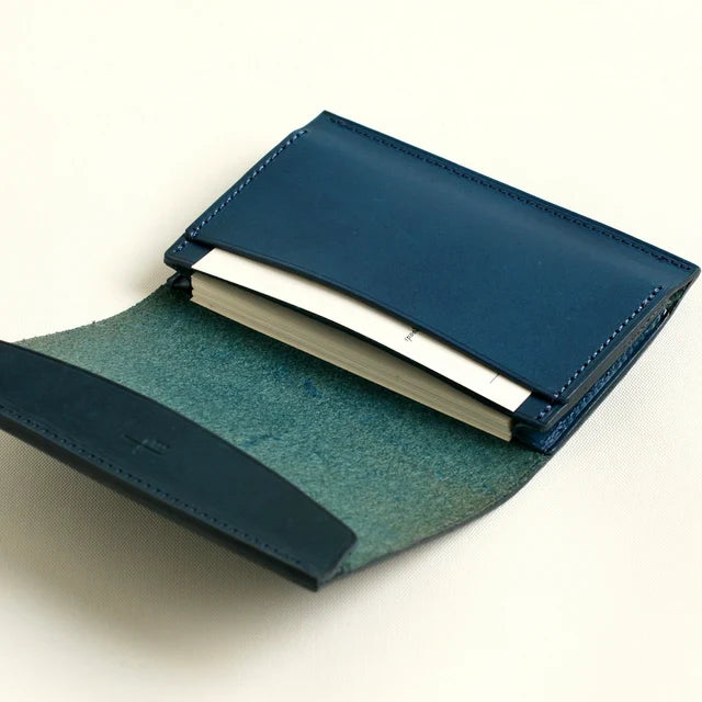 m+ FERMA MATI card case opened with business cards