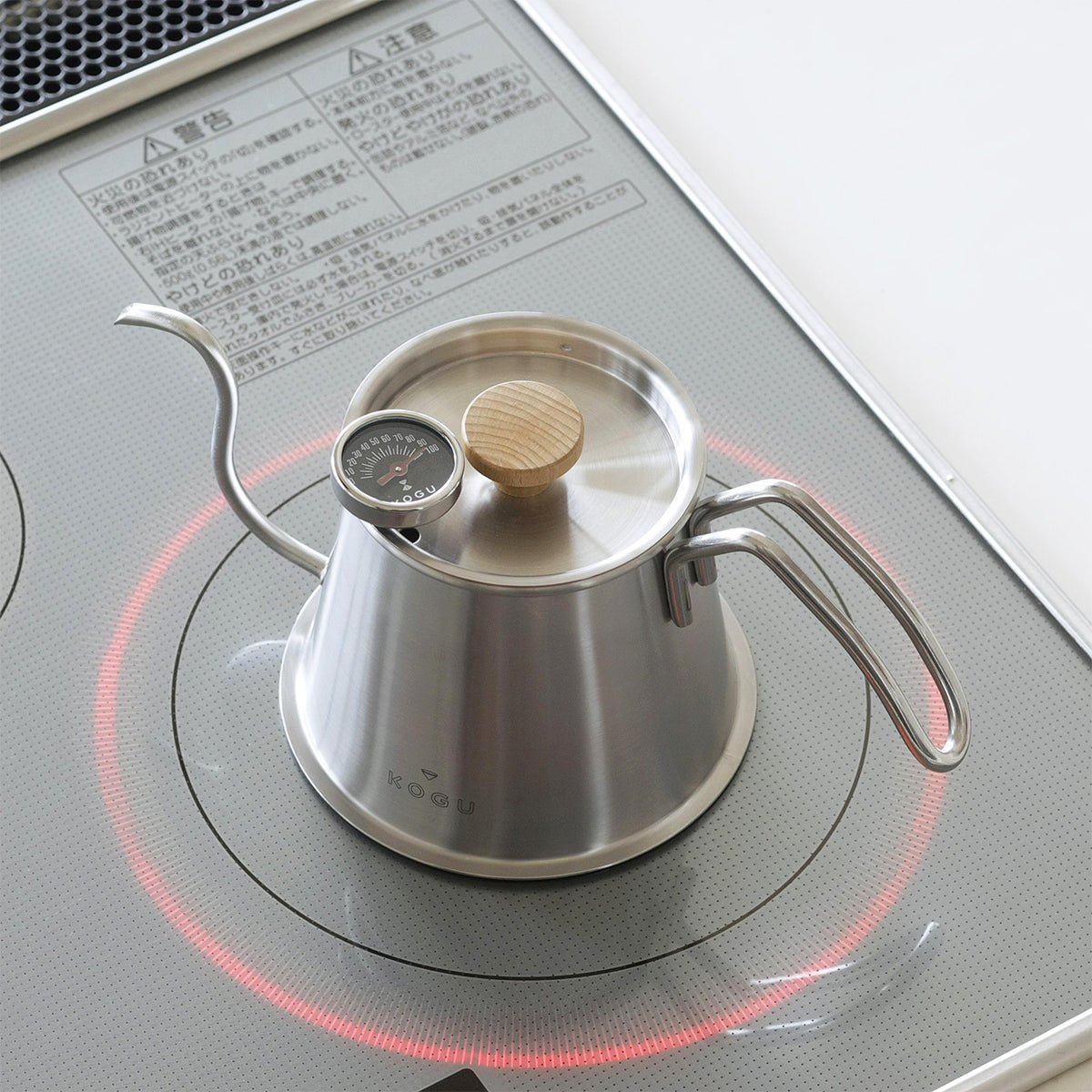 Silver Two Drip Pot Pro with lid and thermometer heating on an IH cooktop