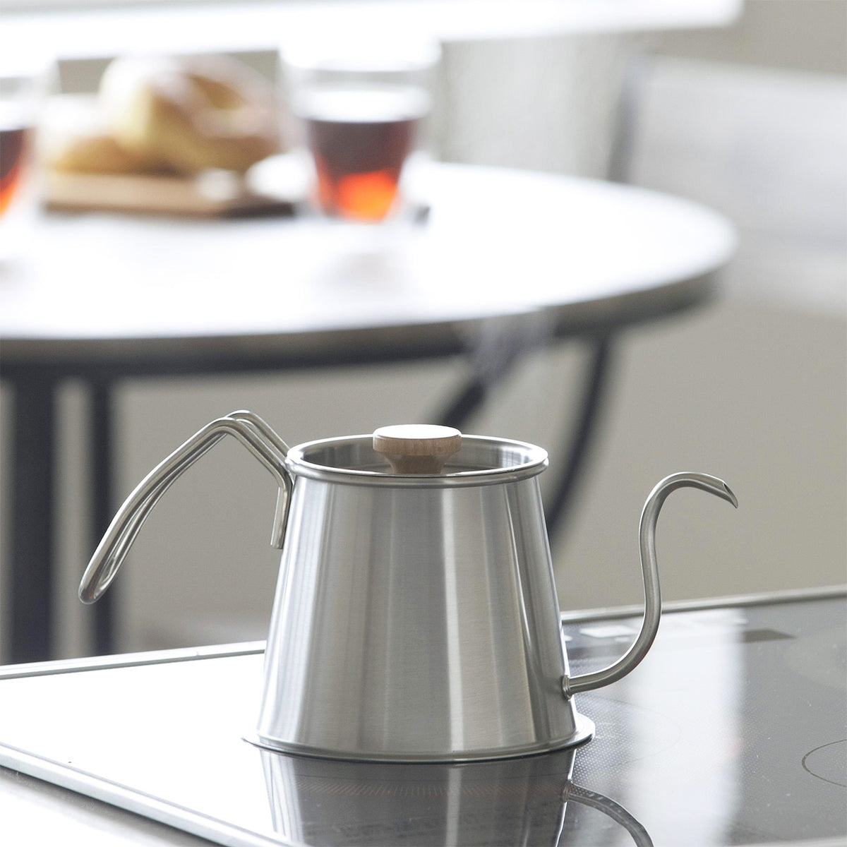 Silver Two Drip Pot Pro without lid on a kitchen counter