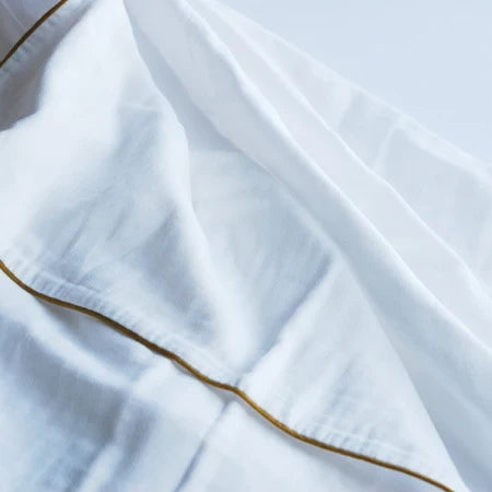 Close-up of the soft Kyo-Wazarashi cotton gauze with gold piping
