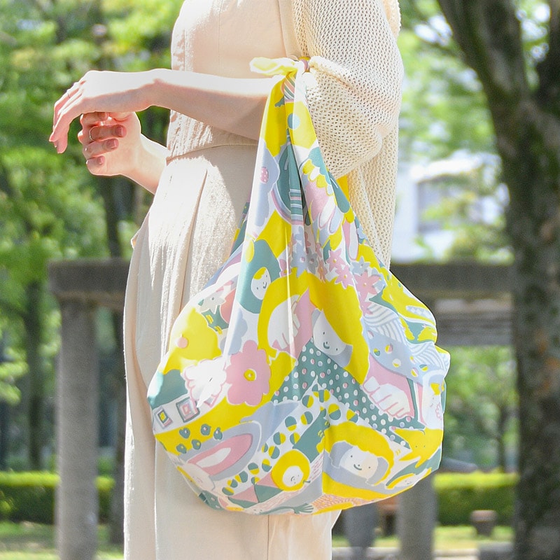 NAGARE furoshiki in Kurukuru World pattern tied as a shoulder bag #Pattern_Kurukuru World