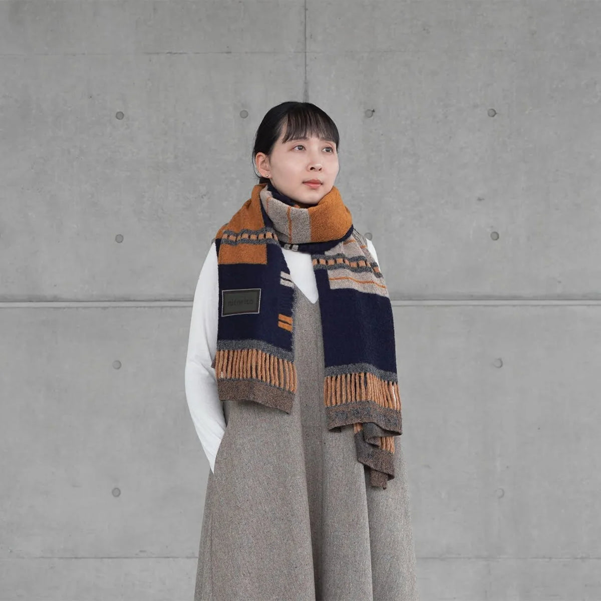 Woman wearing the navy window stole around her neck #Color_Navy