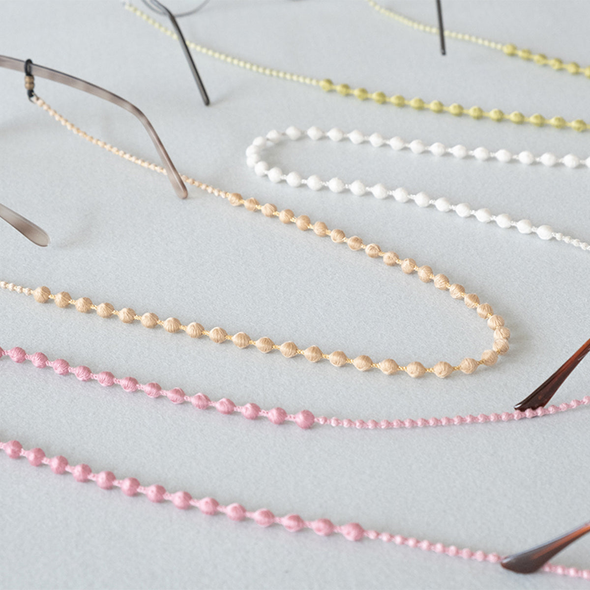 Beaded glasses cords in several colors laid out