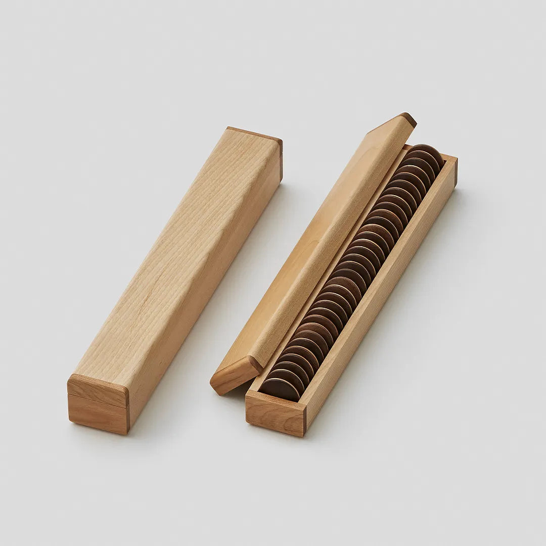 Two wooden cases holding the reversi pieces