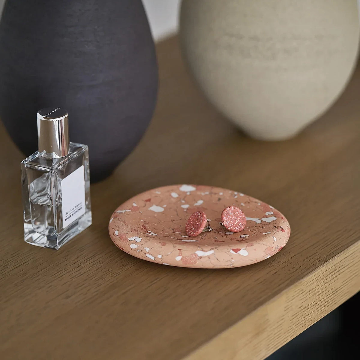 soil aroma stone with perfume and earrings