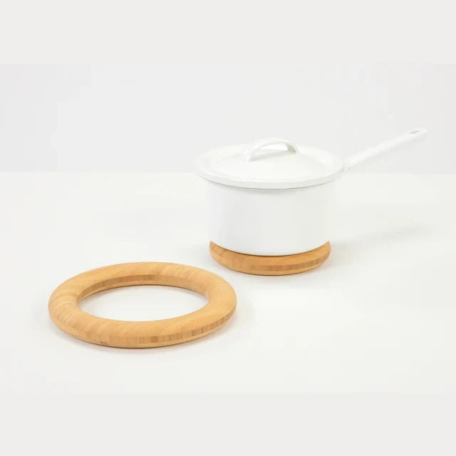 TEORI GRIP bamboo trivet under a white pot