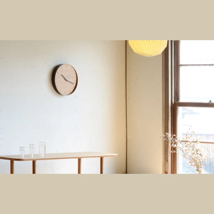 TEORI bamboo wall clock in a bright living room