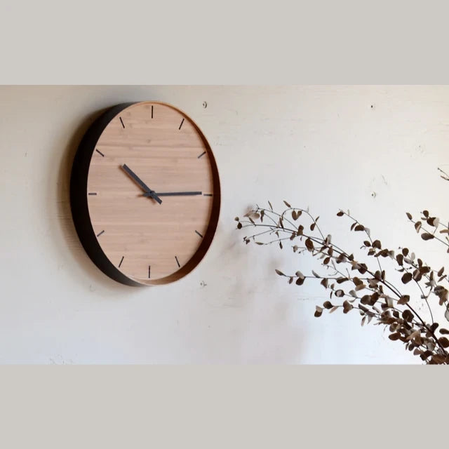 TEORI bamboo wall clock on a white wall