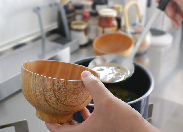 Serving miso soup into an ISHIZUE wooden bowl